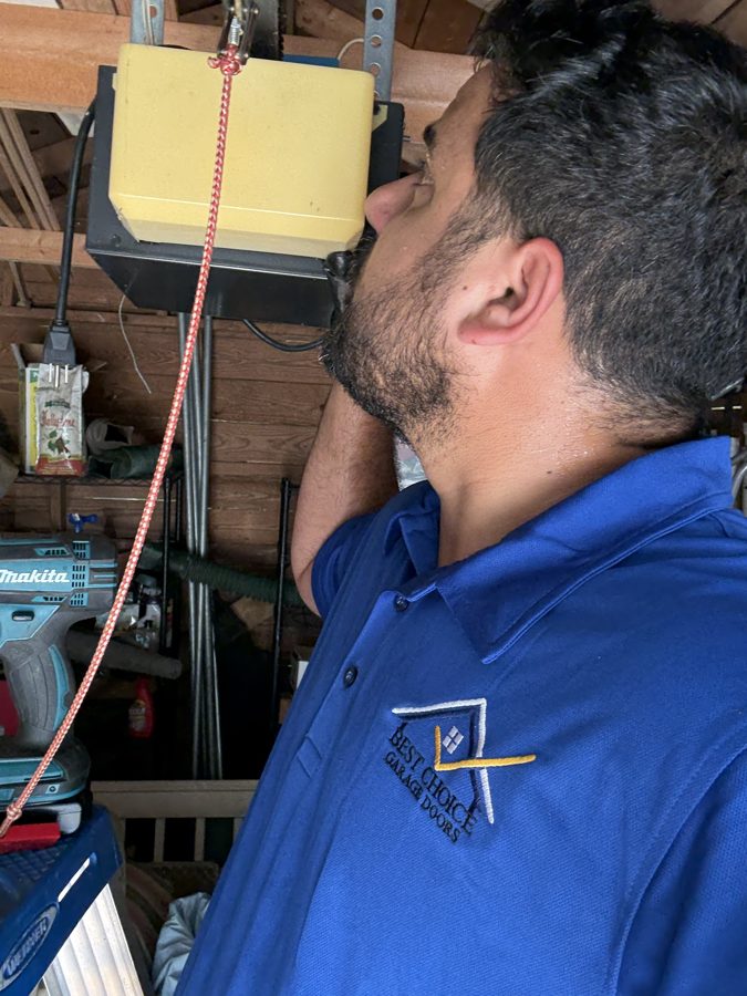 Eli, founder of Best Choice Garage Doors, working on a garage door in Metro Atlanta