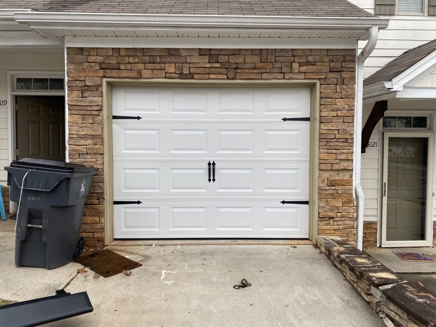 Fresh white garage door after full replacement in Suwanee, GA
