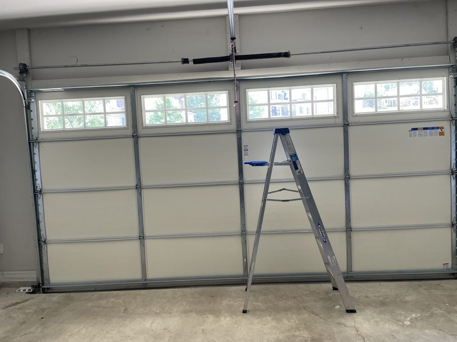 Broken torsion spring before replacement in Alpharetta, GA