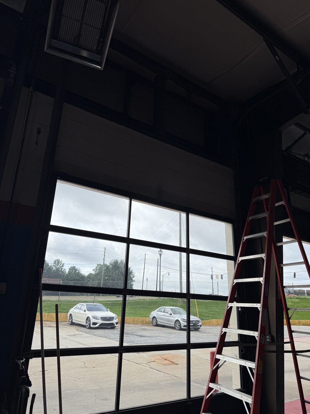 Commercial overhead garage door interior during repair, Doraville GA