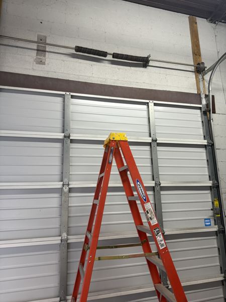 Off track garage door realignment and repair