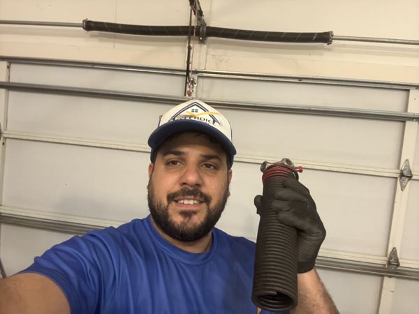 Broken garage door torsion spring replacement in Metro Atlanta