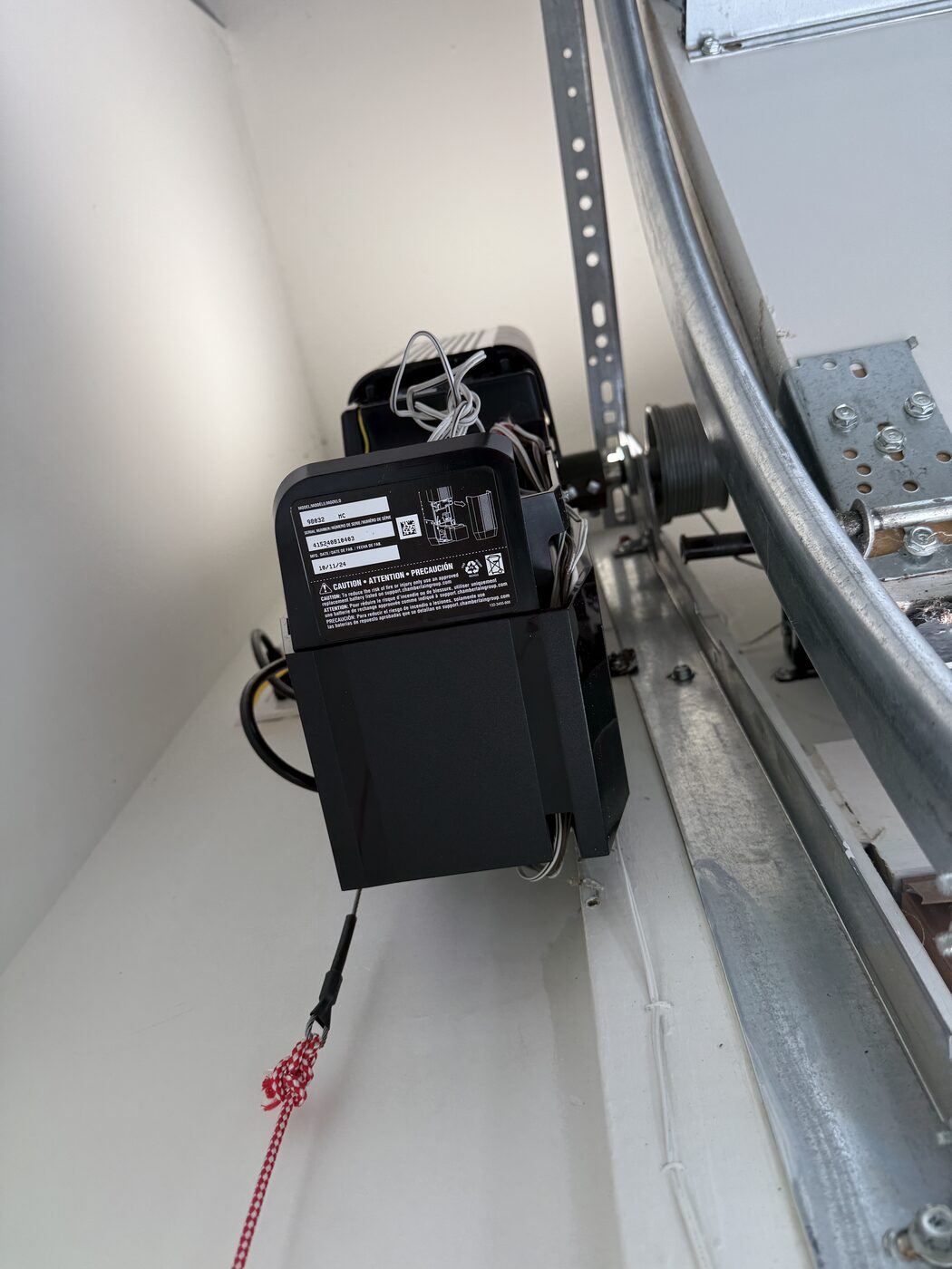 LiftMaster 98032 wall-mounted jackshaft garage door opener installed beside the door, Brookhaven GA