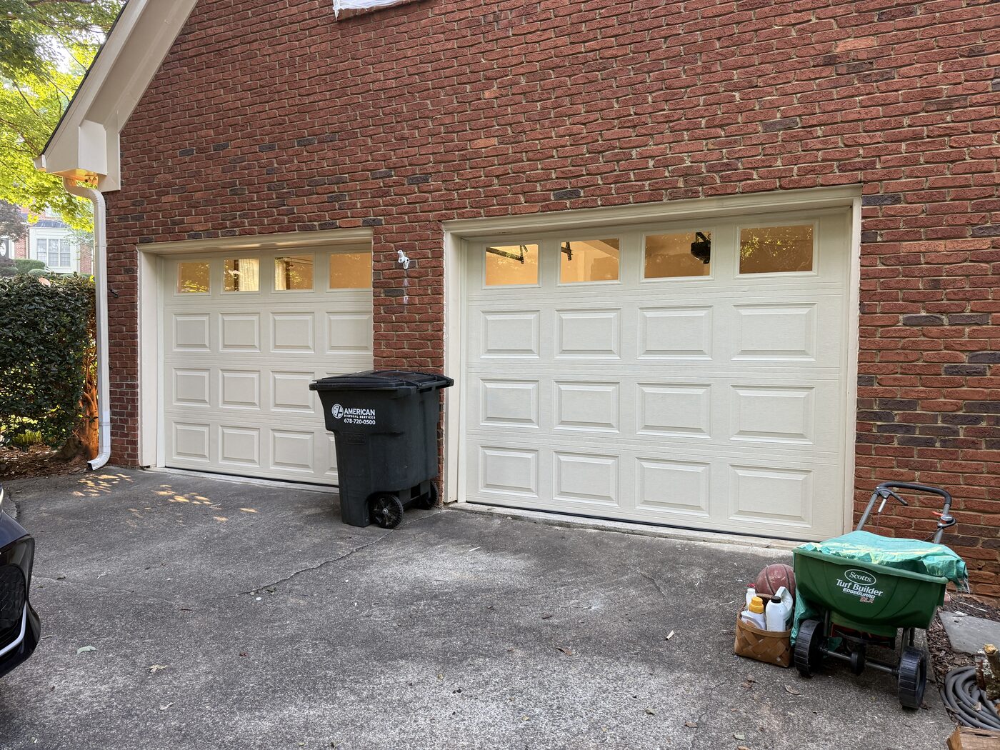 New insulated steel garage doors with windows after installation, Roswell GA