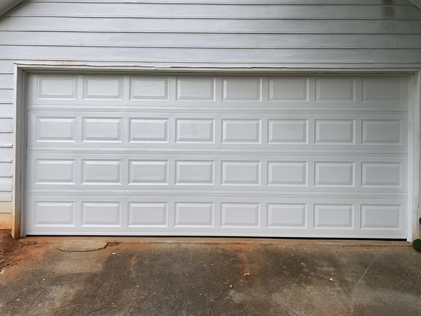 Garage door after two replacement panels fitted and tracks realigned, Dunwoody GA