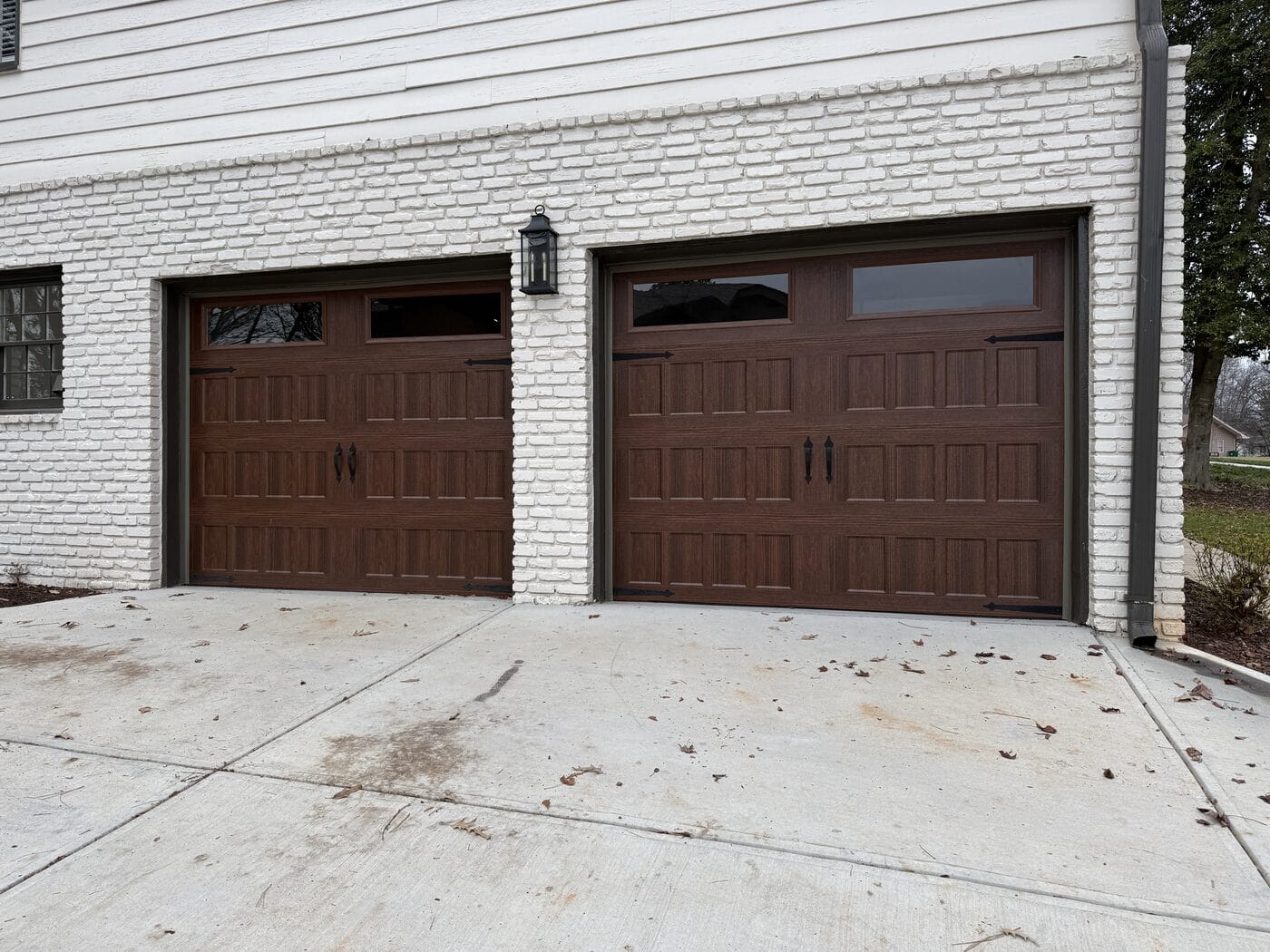 Insulated woodgrain garage doors after a quiet operation upgrade, Dunwoody GA