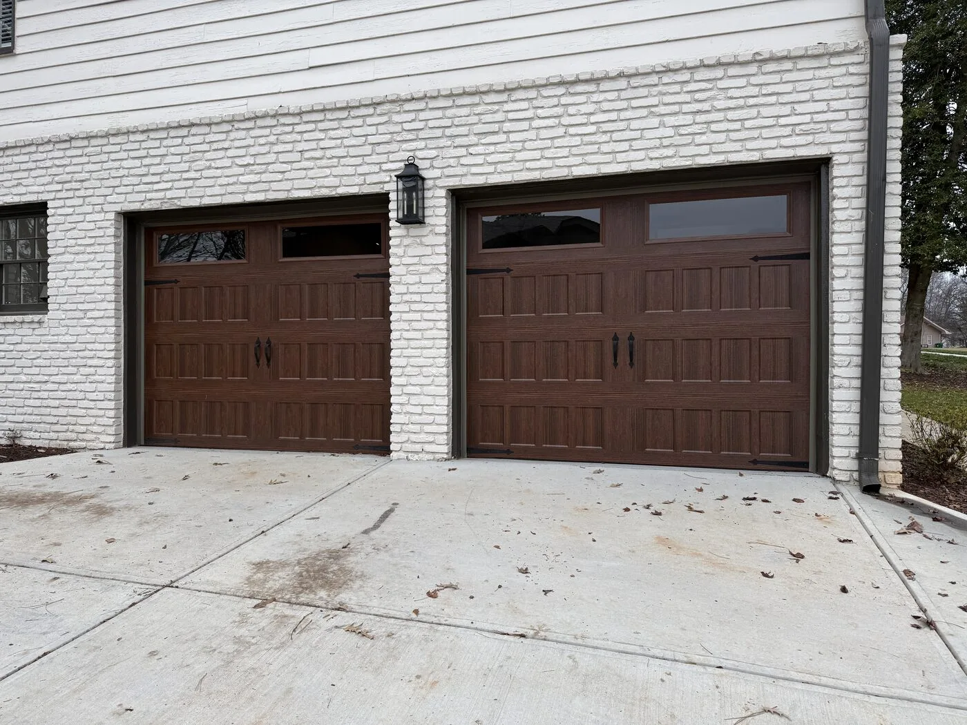 Insulated woodgrain garage doors after a quiet operation upgrade, Dunwoody GA